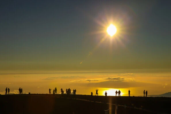 People watch sunrise at Haleakala volcano in Maui