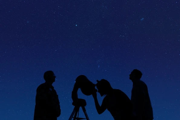 Guests take turns looking through a telescope during Tour of the Stars.
