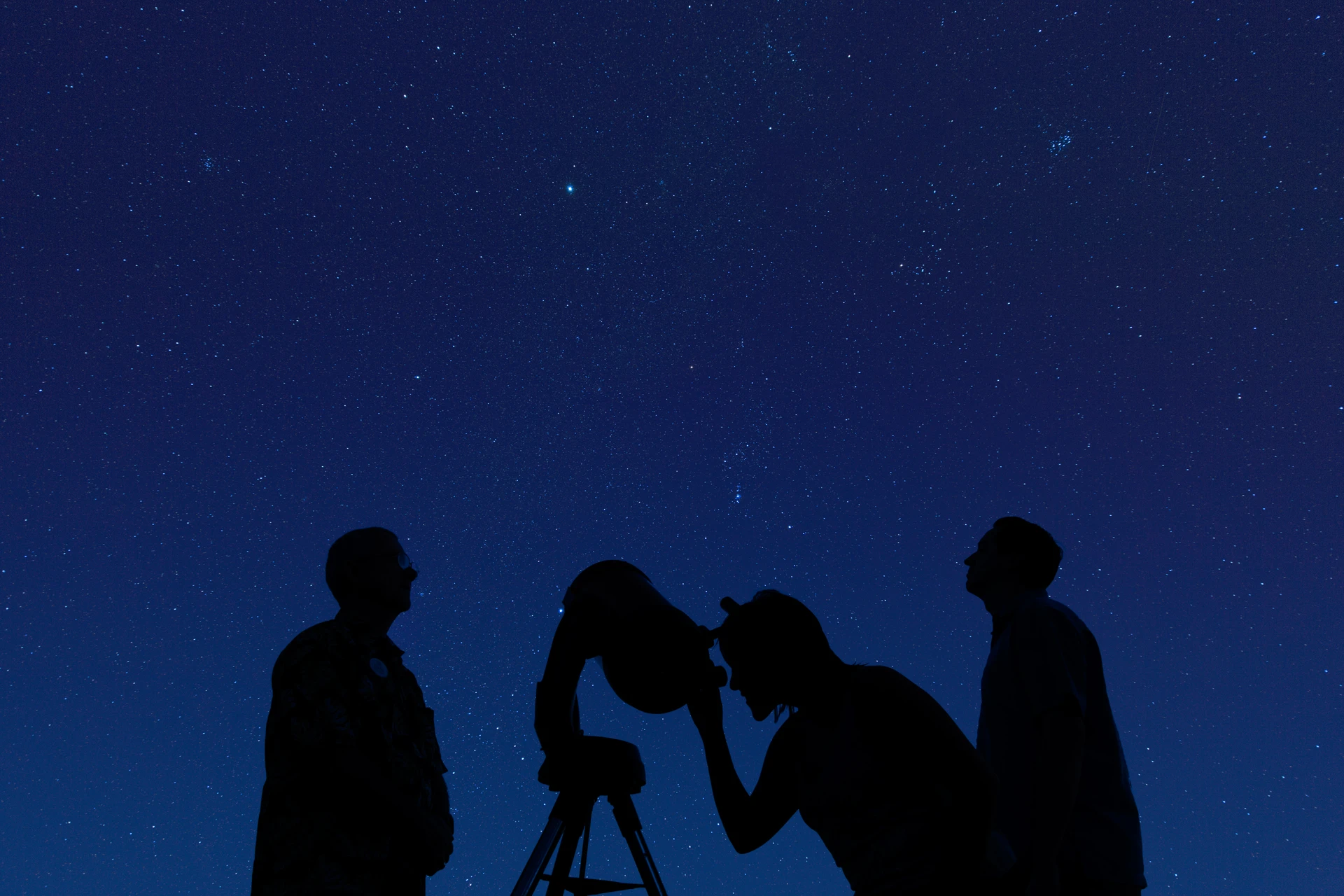 Guests take turns looking through a telescope during Tour of the Stars.