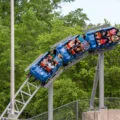 Guests ride a roller coaster at King's Dominion theme park in Virginia.