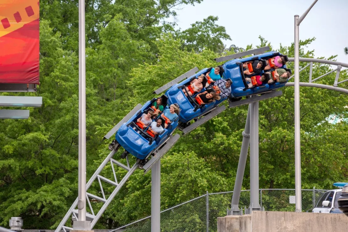 Guests ride a roller coaster at King's Dominion theme park in Virginia.