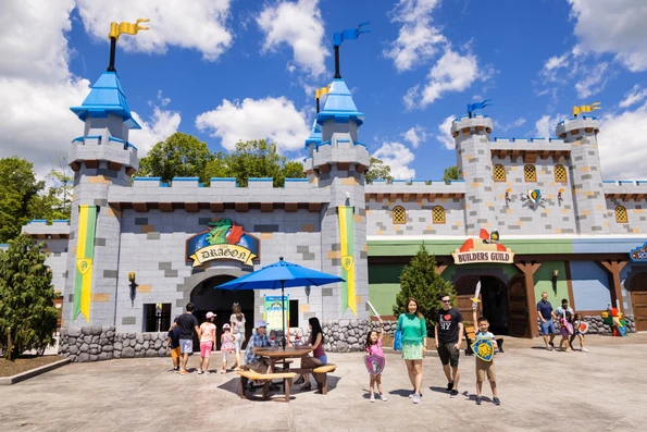A family walks out of Builders Guild Castle.