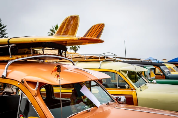 Classic woody cars lined up at Moonlight State Beach for the Wavecrest Woodie Meet.
