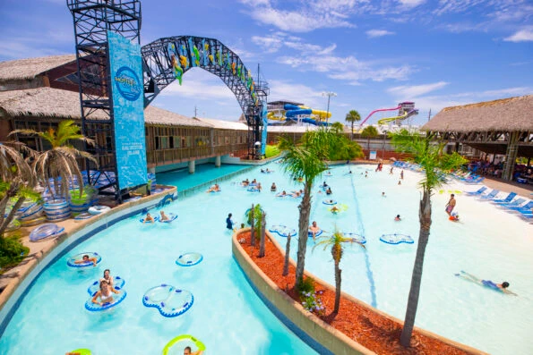 Guests float around a large pool in rafts at Schlitterbahn Galveston.