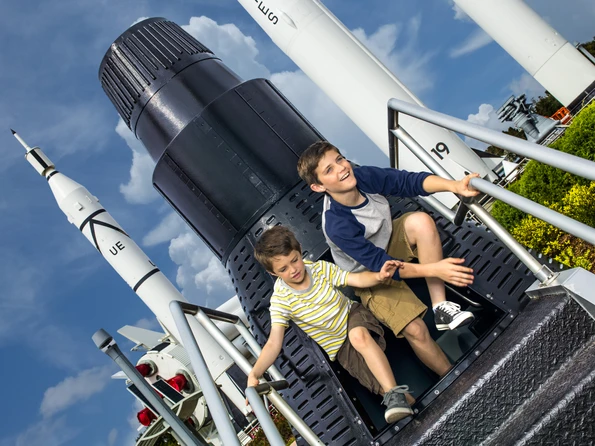 Kids play in the Rocket Garden at Kennedy Space Center in Florida.