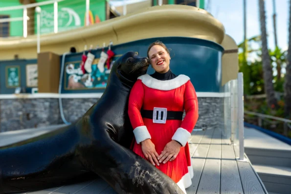 A awoman with Sea Lion_Ozzy in Seaworld San Diego