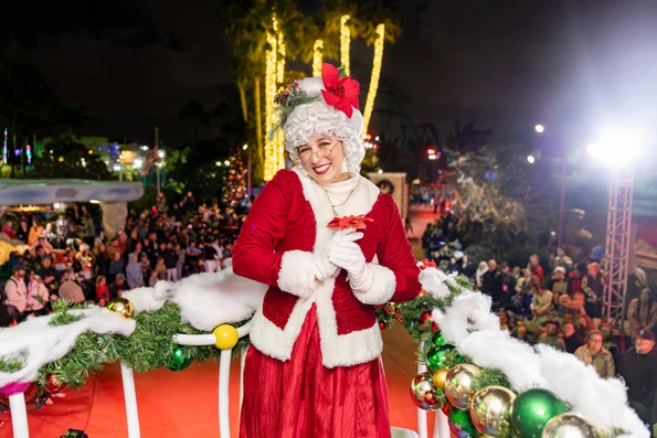 Mrs Claus holding a red flower in Seaworld San Diego