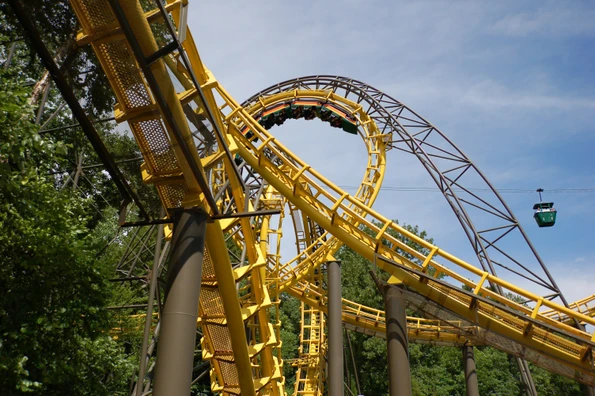 A roller coaster with aerial tram in the background at Busch Gardens Wiliamsburg.