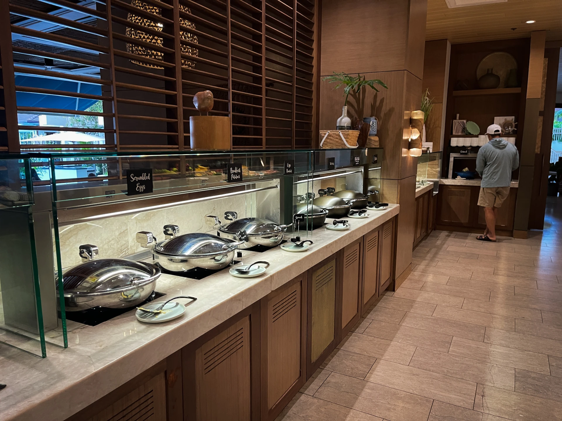 Row of hot dishes at the breakfast buffet.