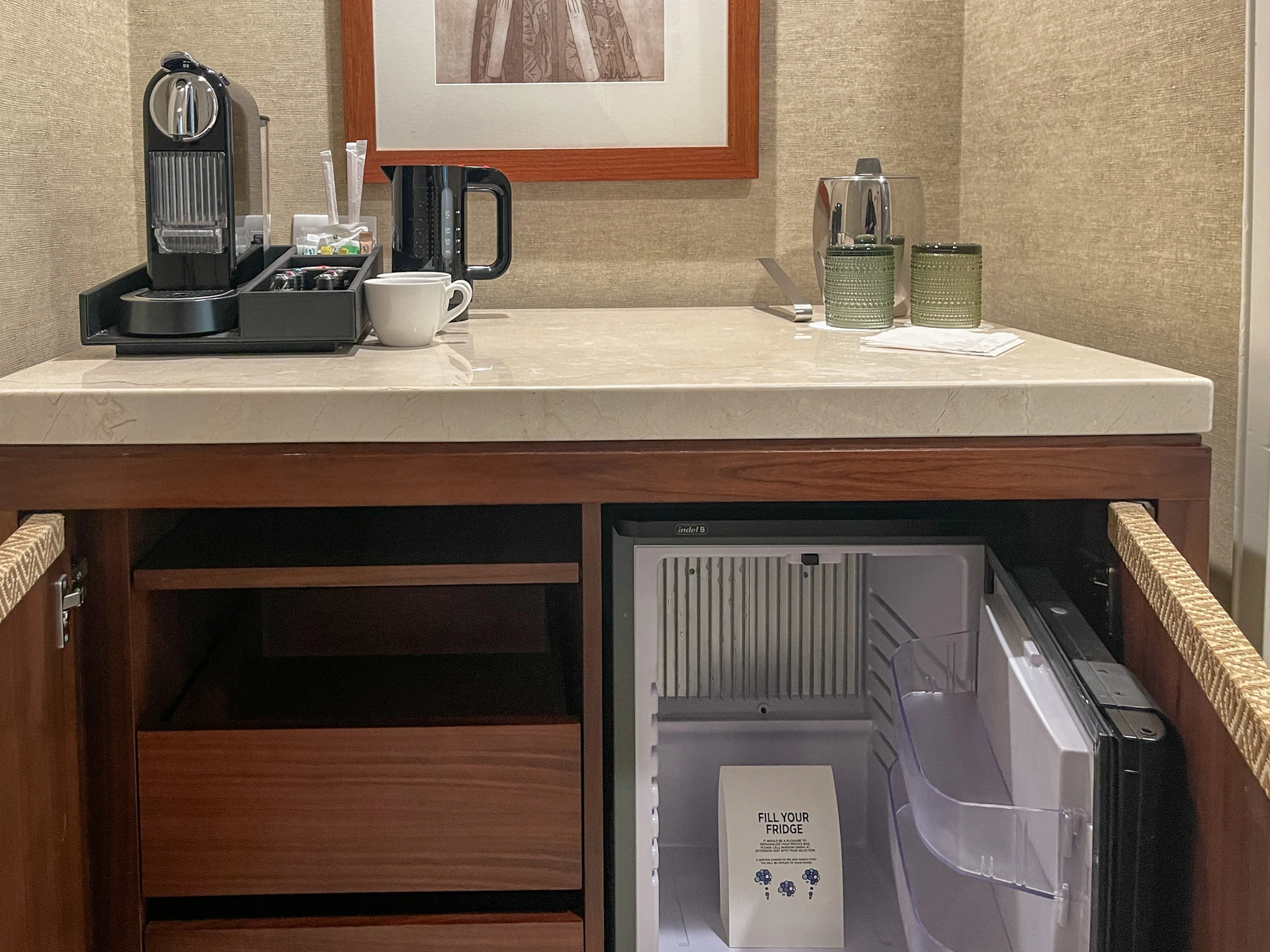 The coffee station in rooms at Four Seasons Oahu with lots of empty storage space.