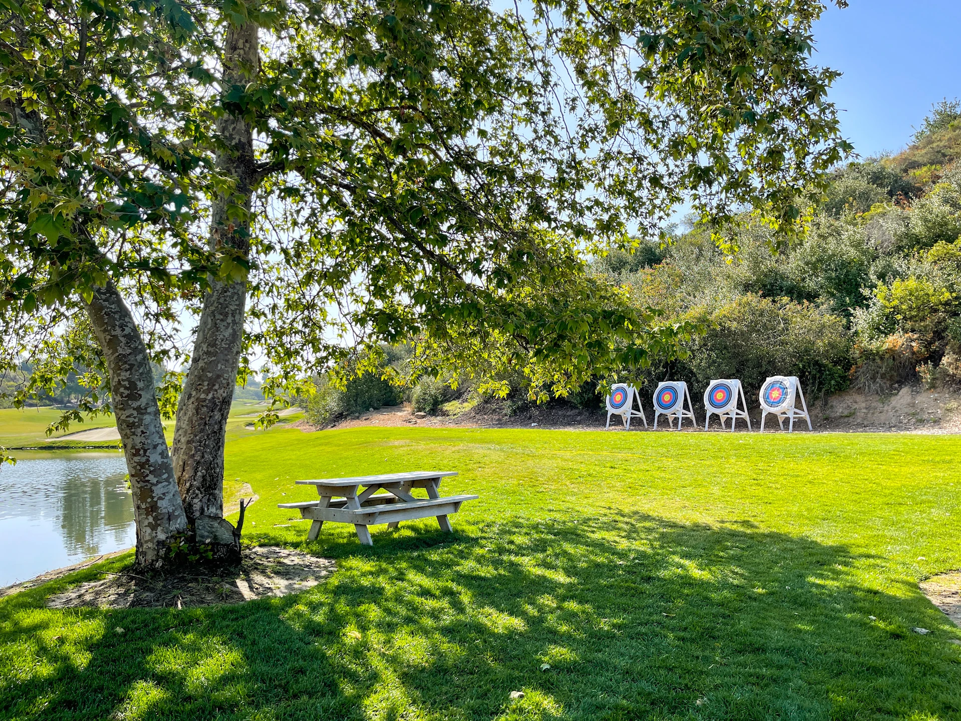 Archery targets lined up on grass at Fairmont Grand Del Mar.