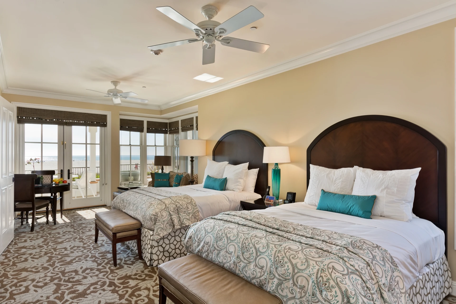 Two queen beds in a Beach Village Cottage Room