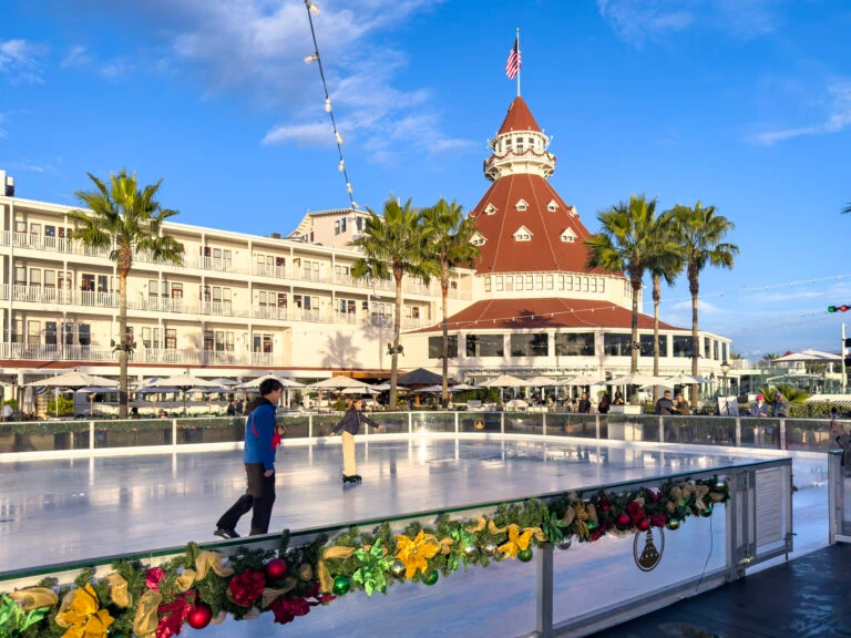 A guest ice skates in front of Hotel del Coronado in November.