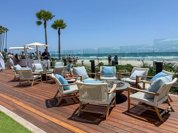 Seating around fire pits at the edge of the pool at Shore House.