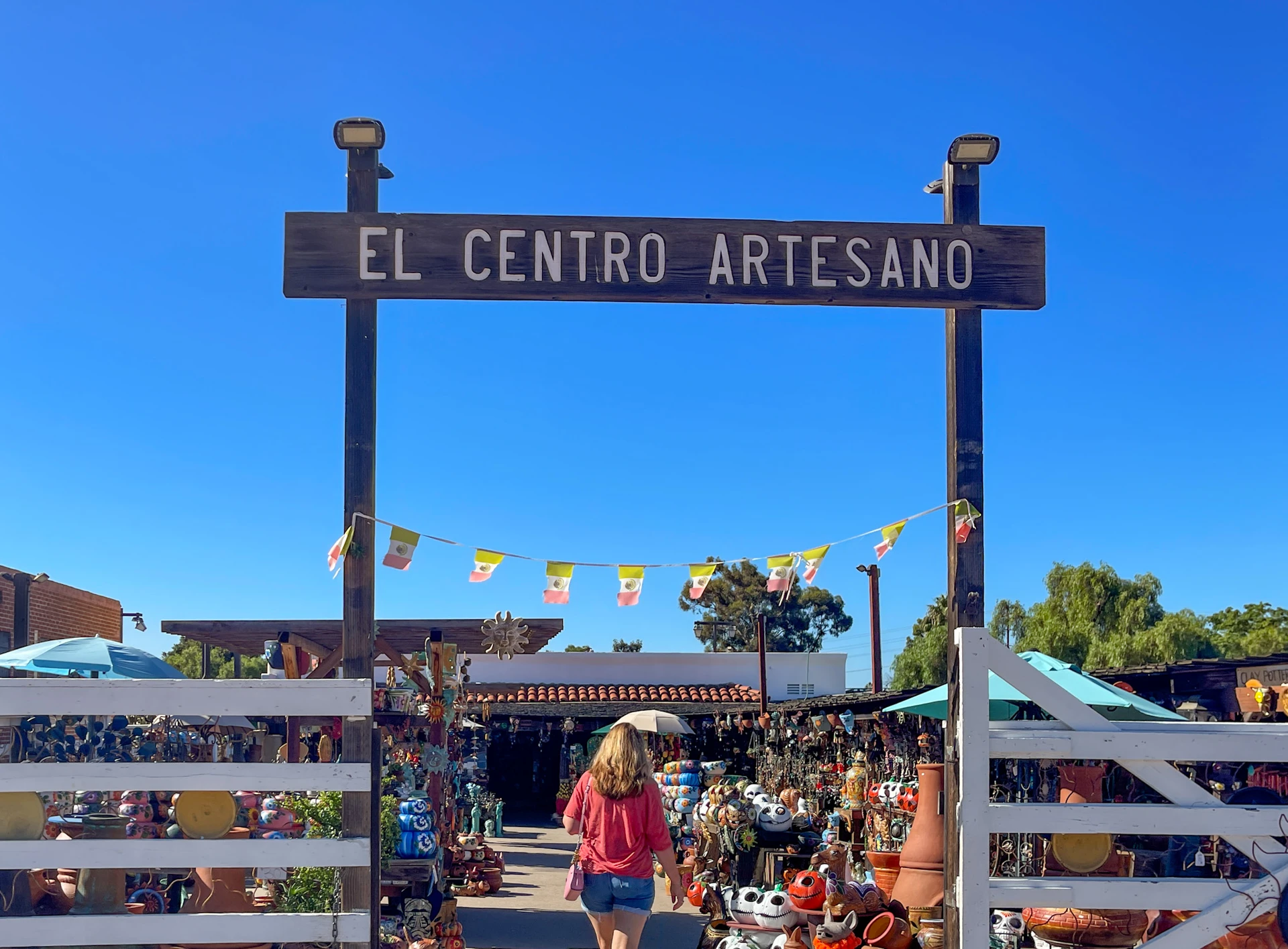 A woman enters El Centro Artesano in Old Town.
