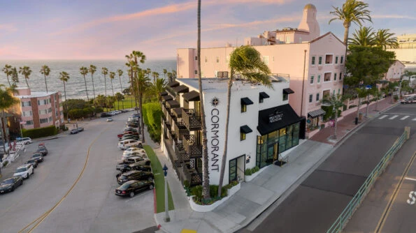 Street corner view of Cormorant hotel exterior.