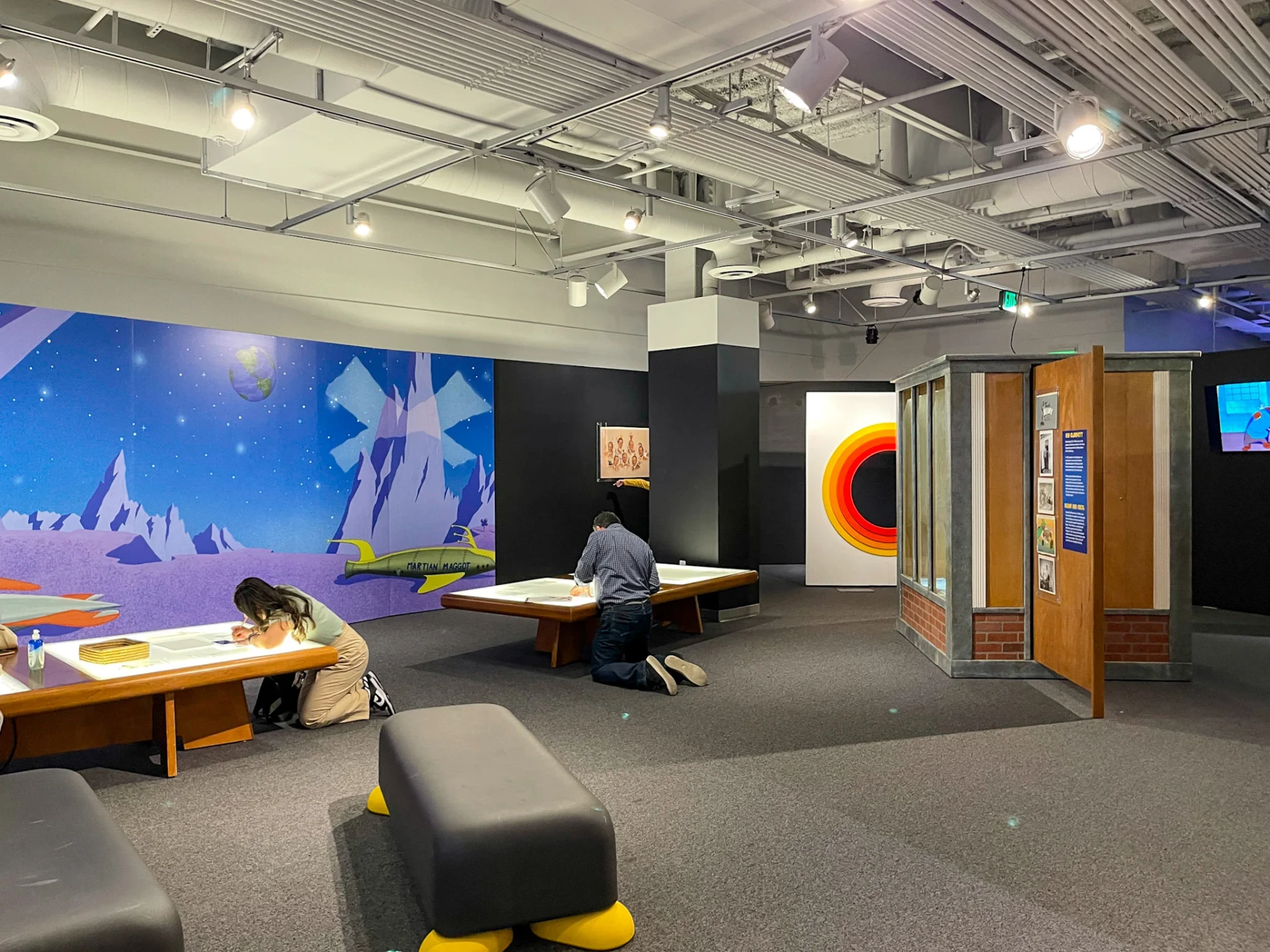 Guests drawing art in the Animation Academy.