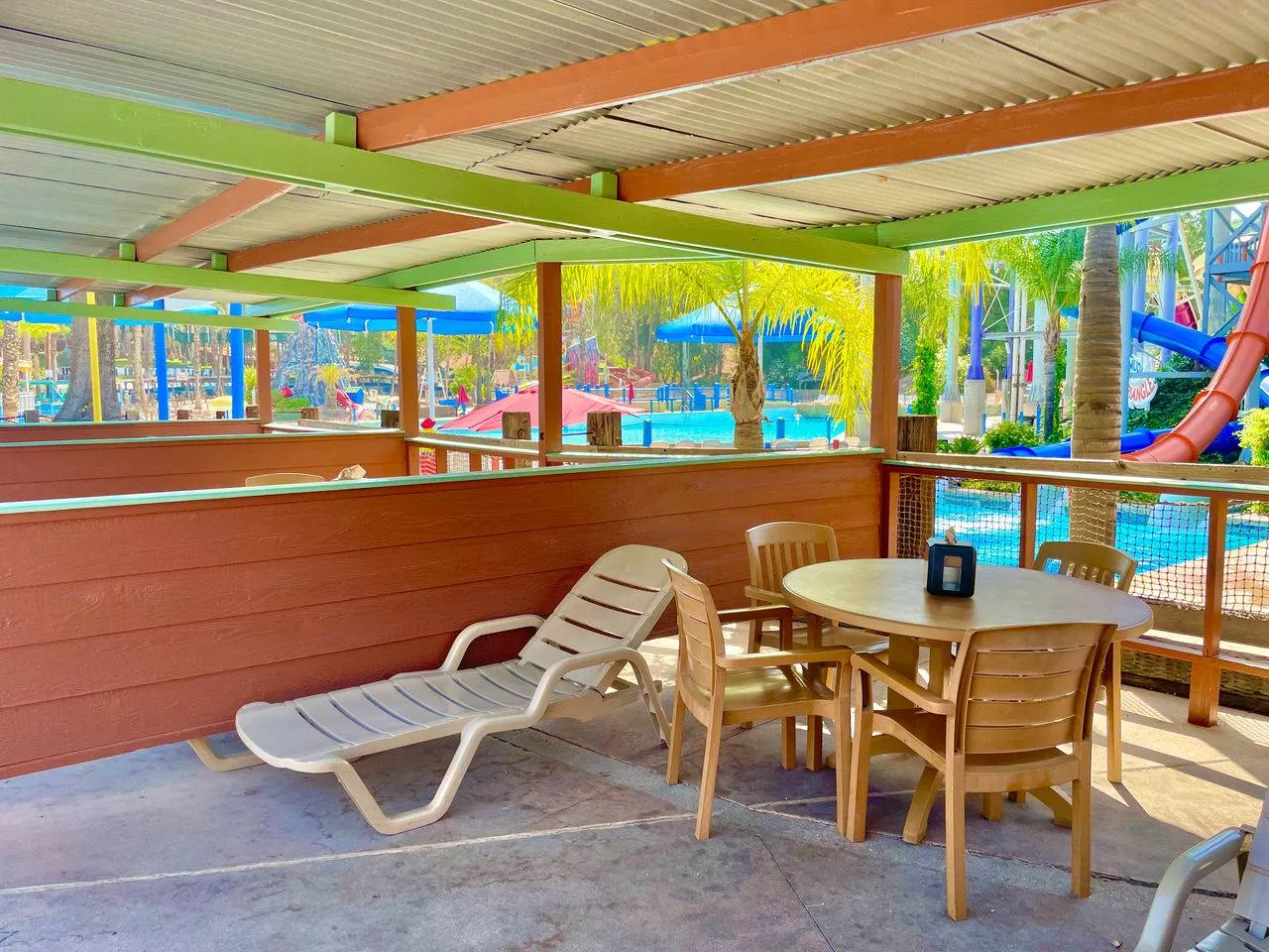 Cabana shade area near a water slide.