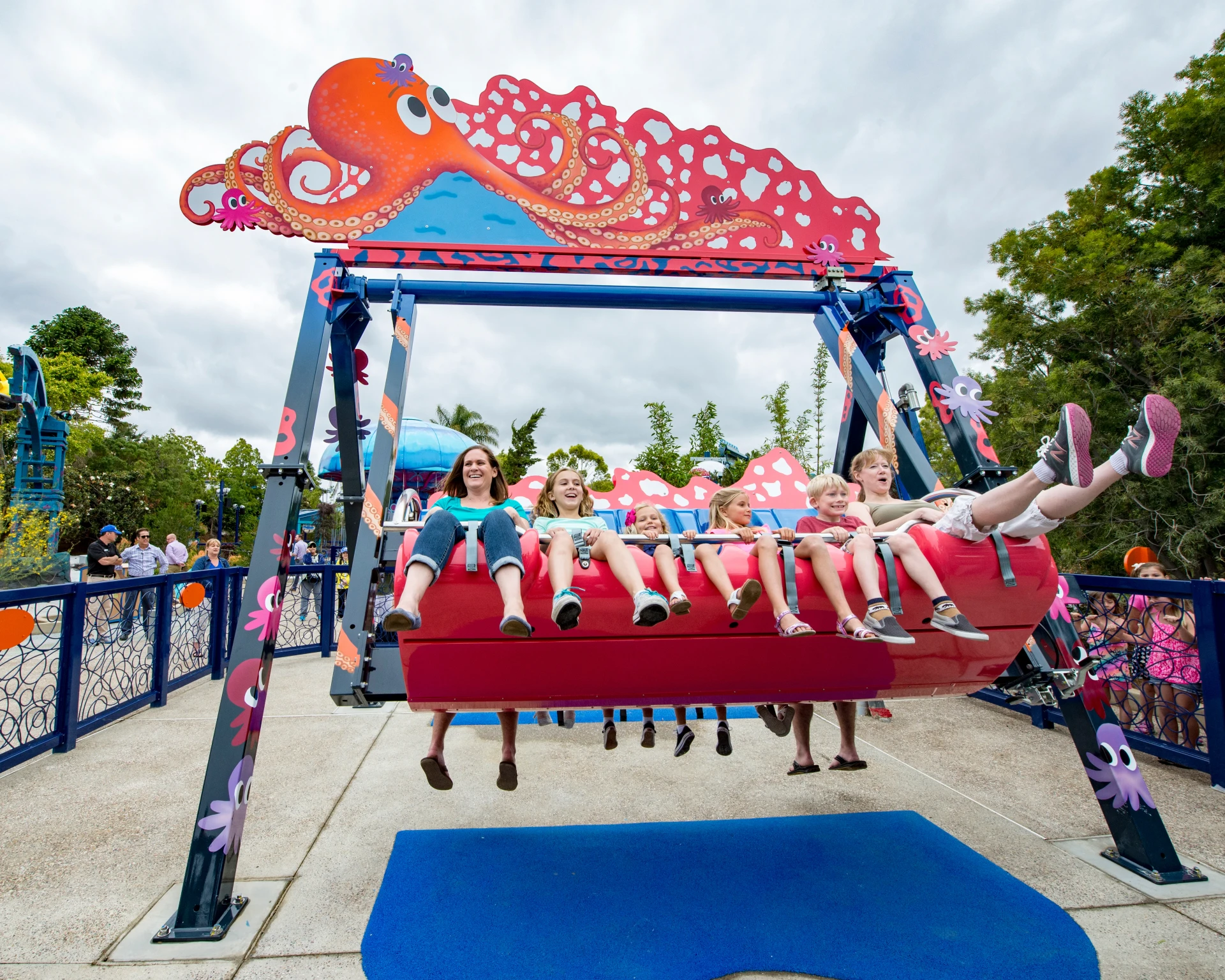 Families ride on the Octarock in Rescue Jr. area at SeaWorld San Diego.