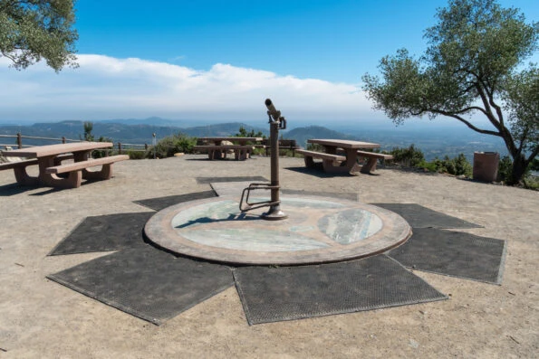 The telescope and picnic tables at the top of Double Peak Park.