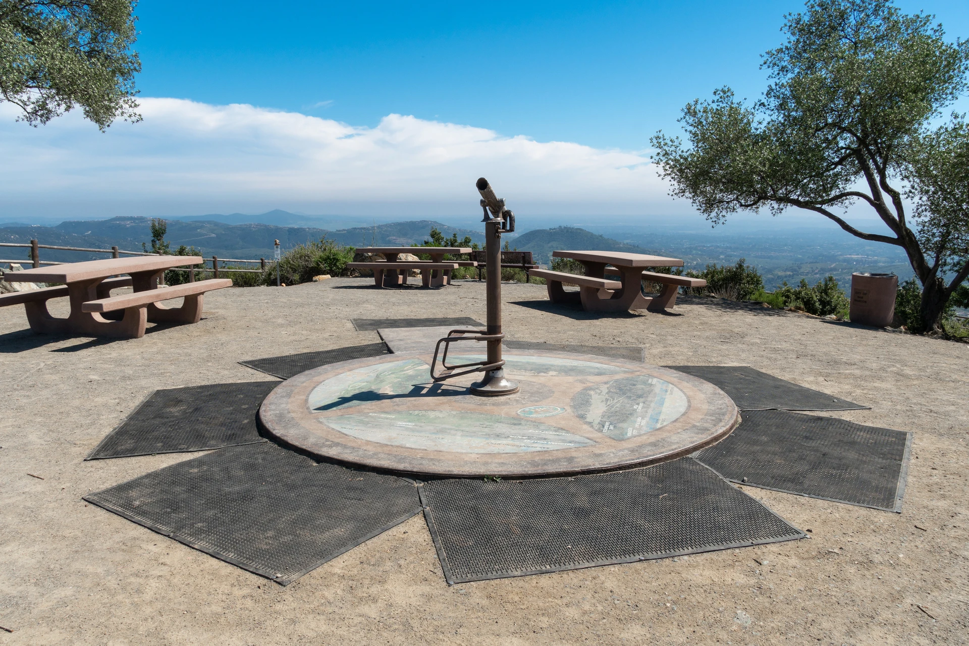 The telescope and picnic tables at the top of Double Peak Park.