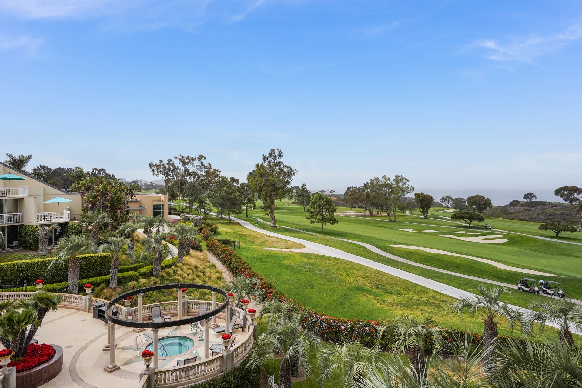A side view of the jacuzzi and golf course.
