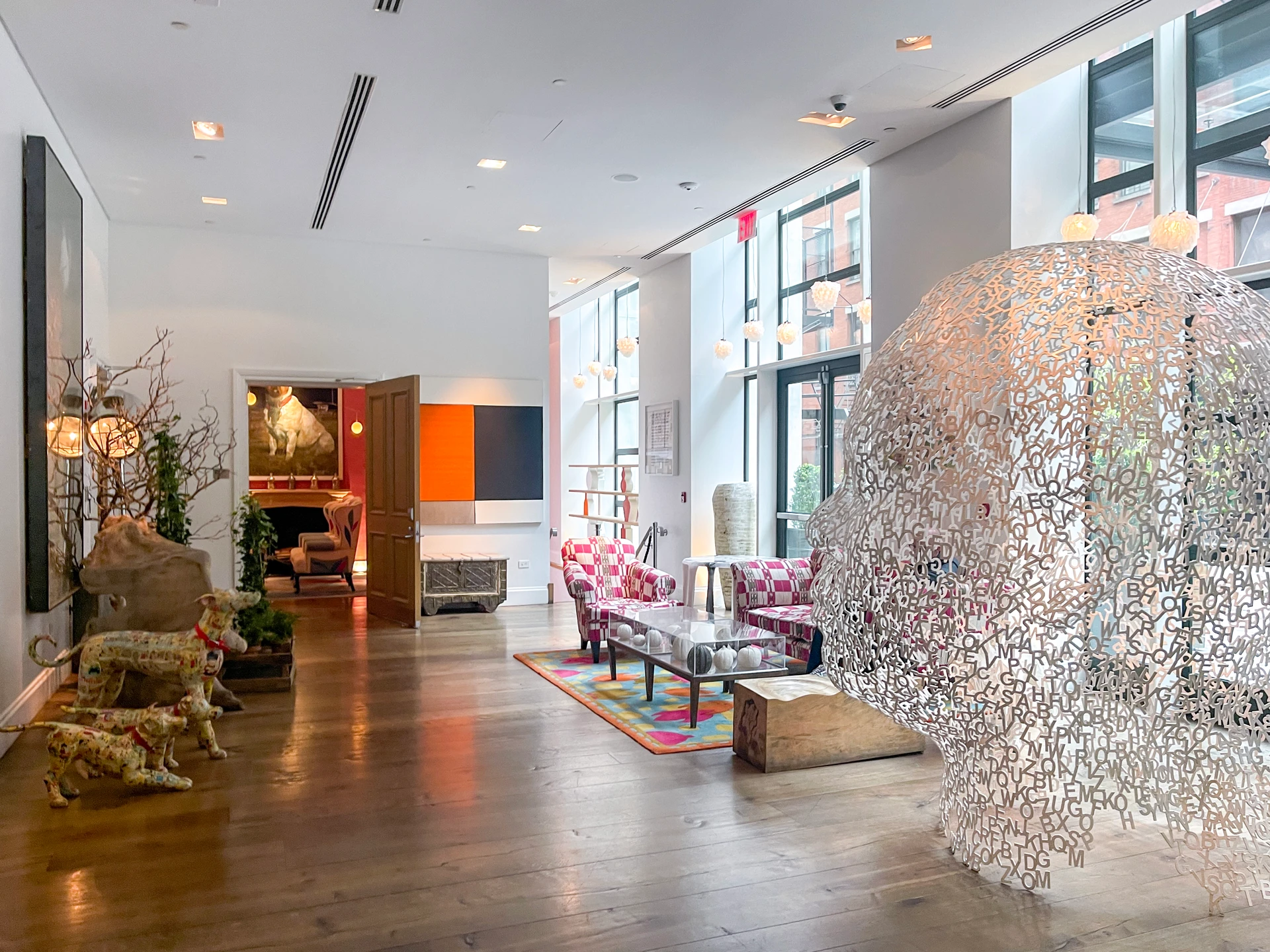 Sculptures and seating in the lobby area of Crosby Street Hotel.