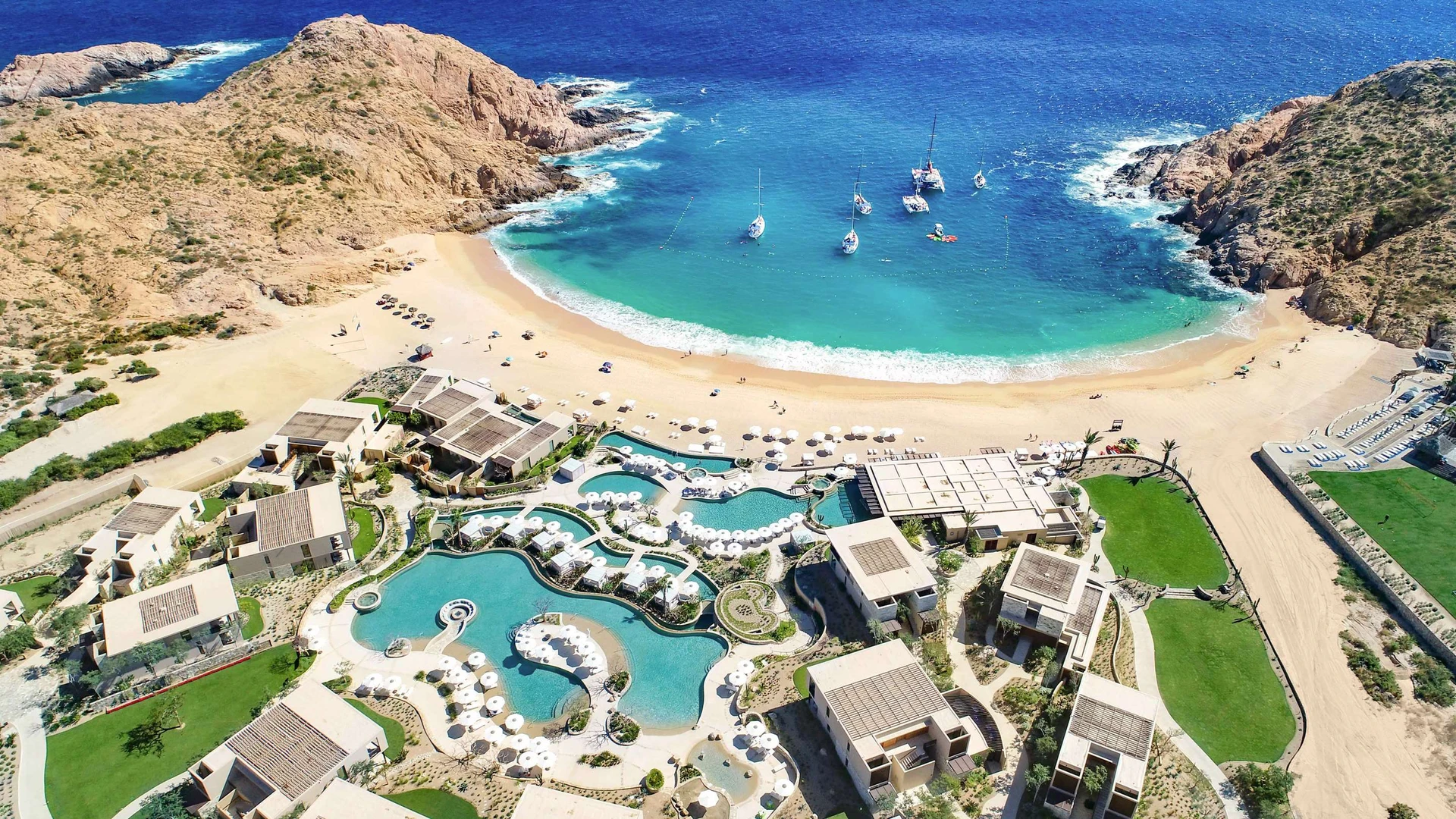 Aerial view of Montage Los Cabos resort and its sandy swimmable beach.