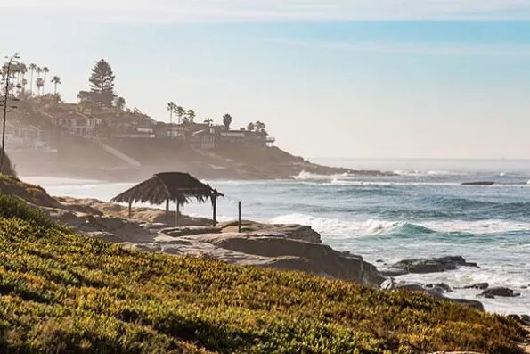 The Windansea Beach Shack sits on the bluff with the ocean in the background.