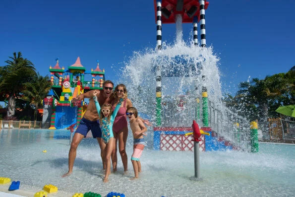 A family plays in the water at LEGOLAND California Water Park.