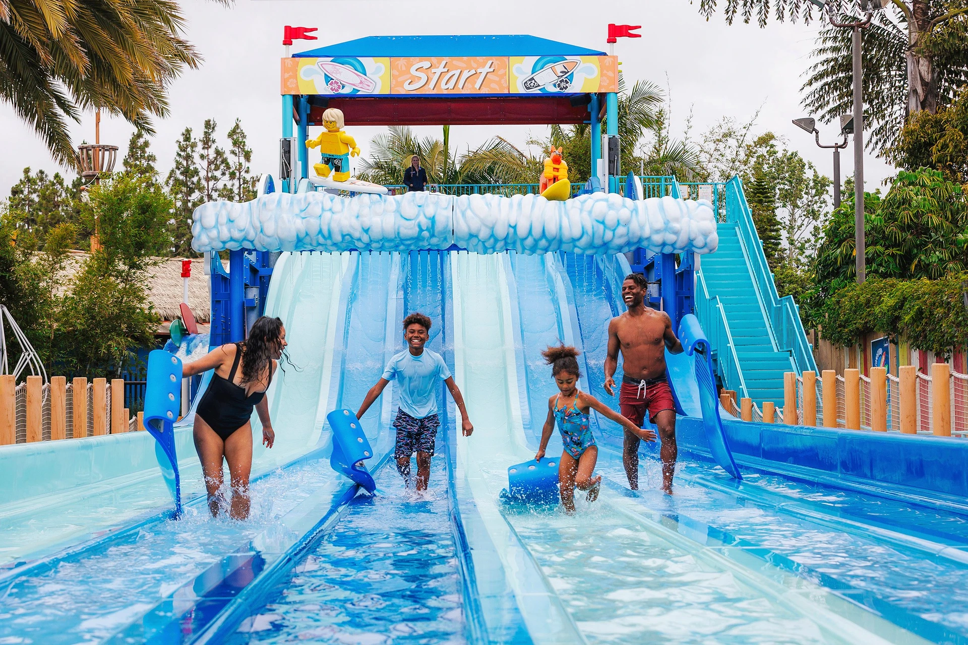 A family rides down Riptide Racers at LEGOLAND Water Park.