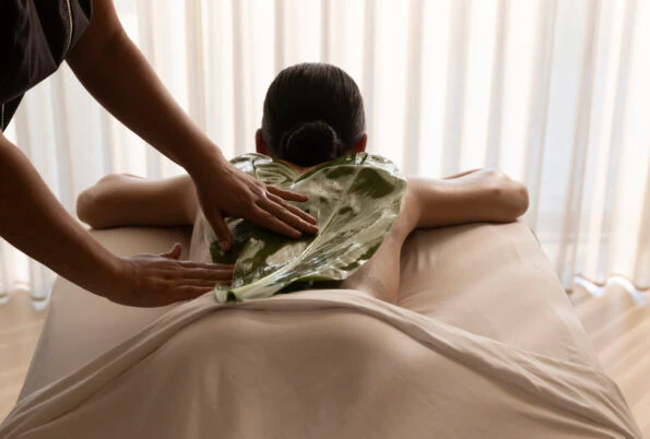 Woman relaxing and getting massage at Four Seasons Lanai Spa