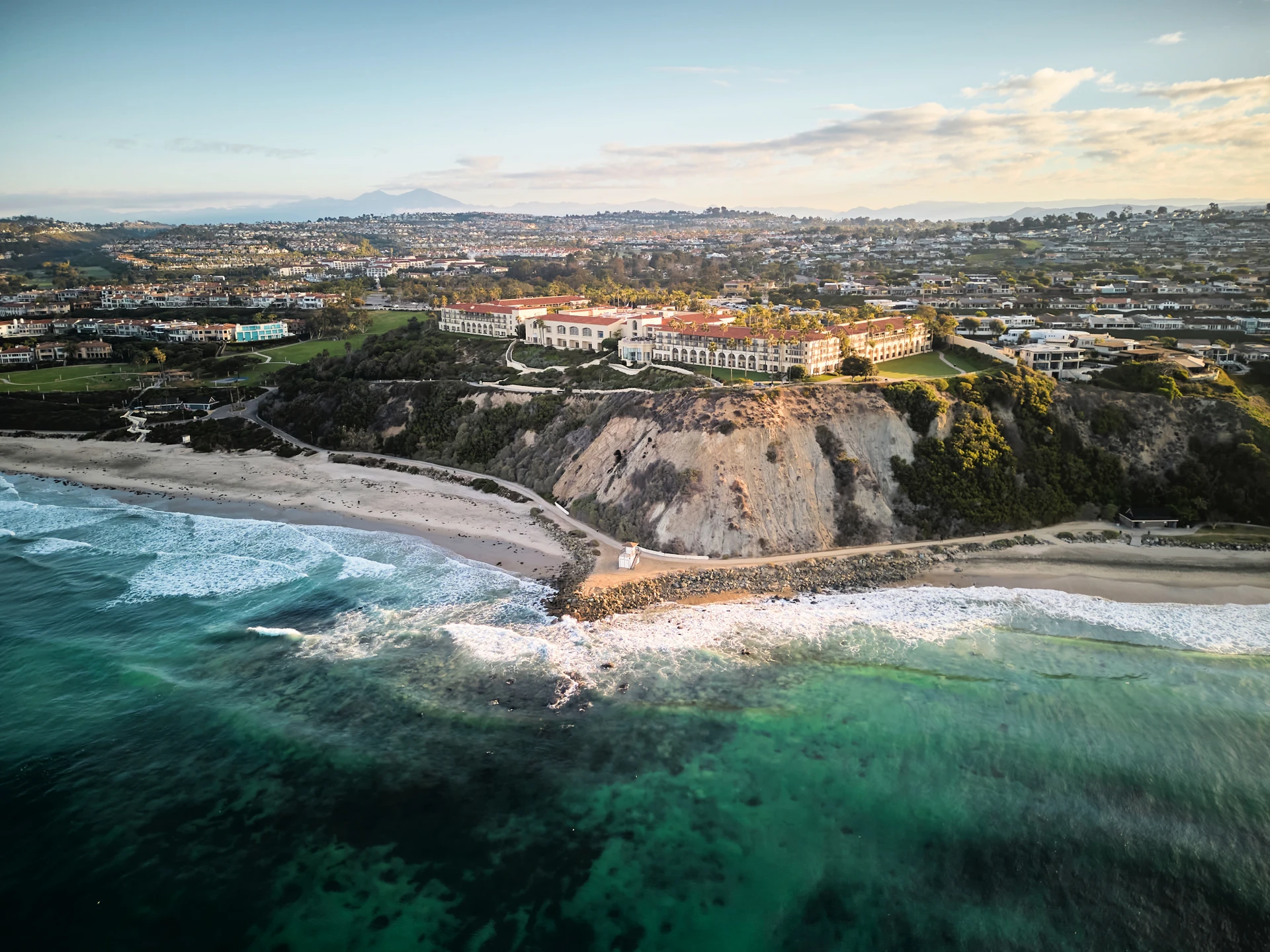 Aerial view of The Ritz-Carlton Laguna Niguel sitting above the ocean.