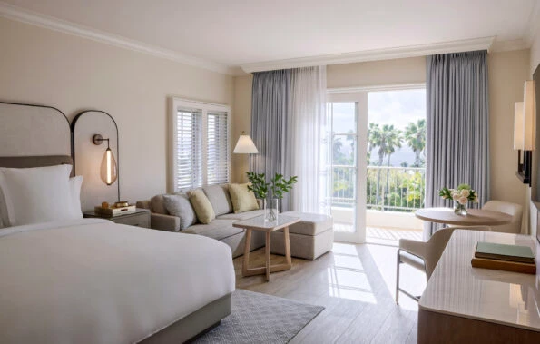 A Superior King room interior decorated in coastal hues.