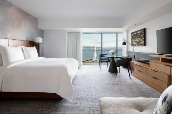 Deluxe Bay View room king interior with view to bay.