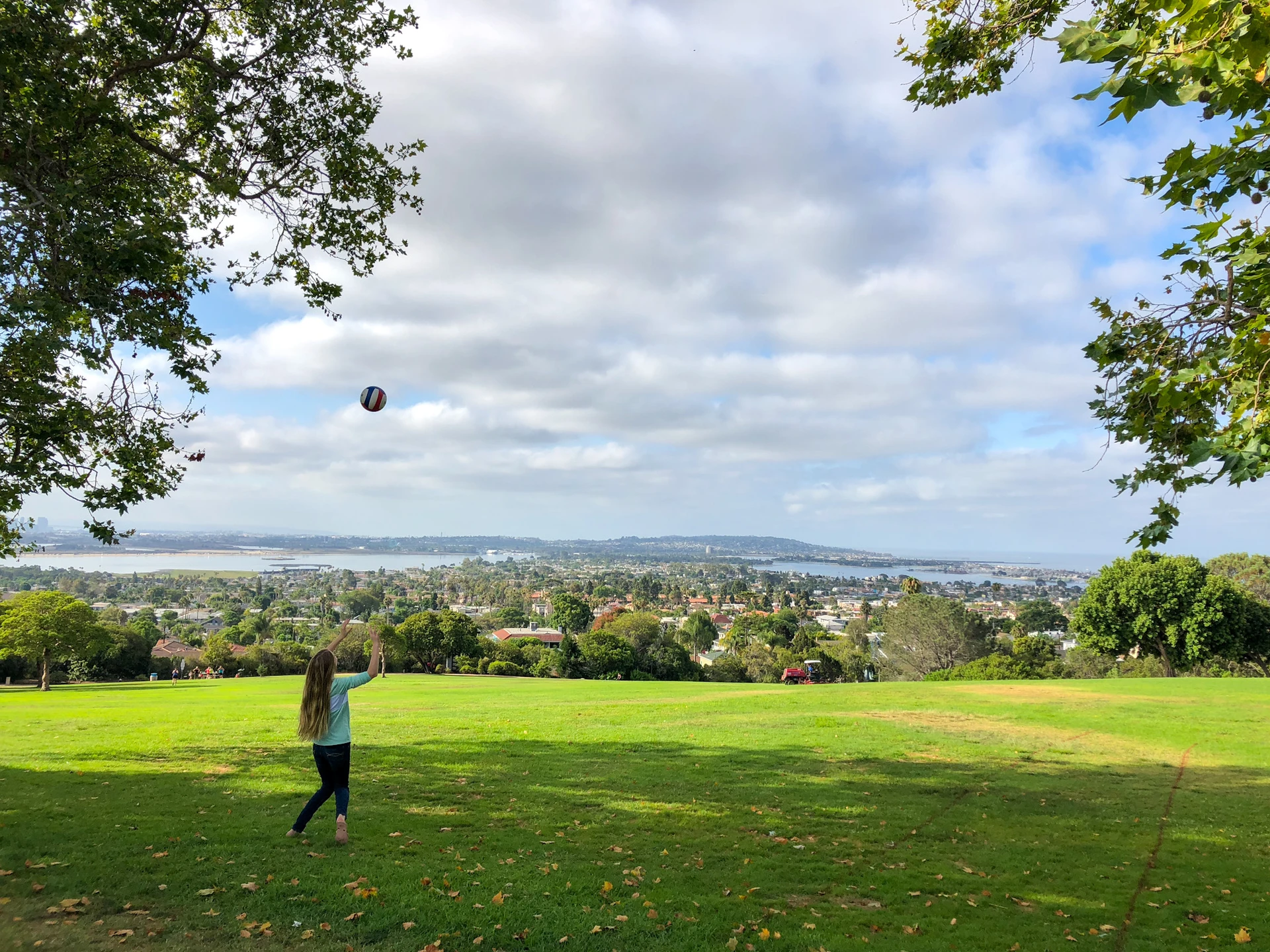Katie's daughter plays volleyball at Kate Sessios Park with the ocean view in front.