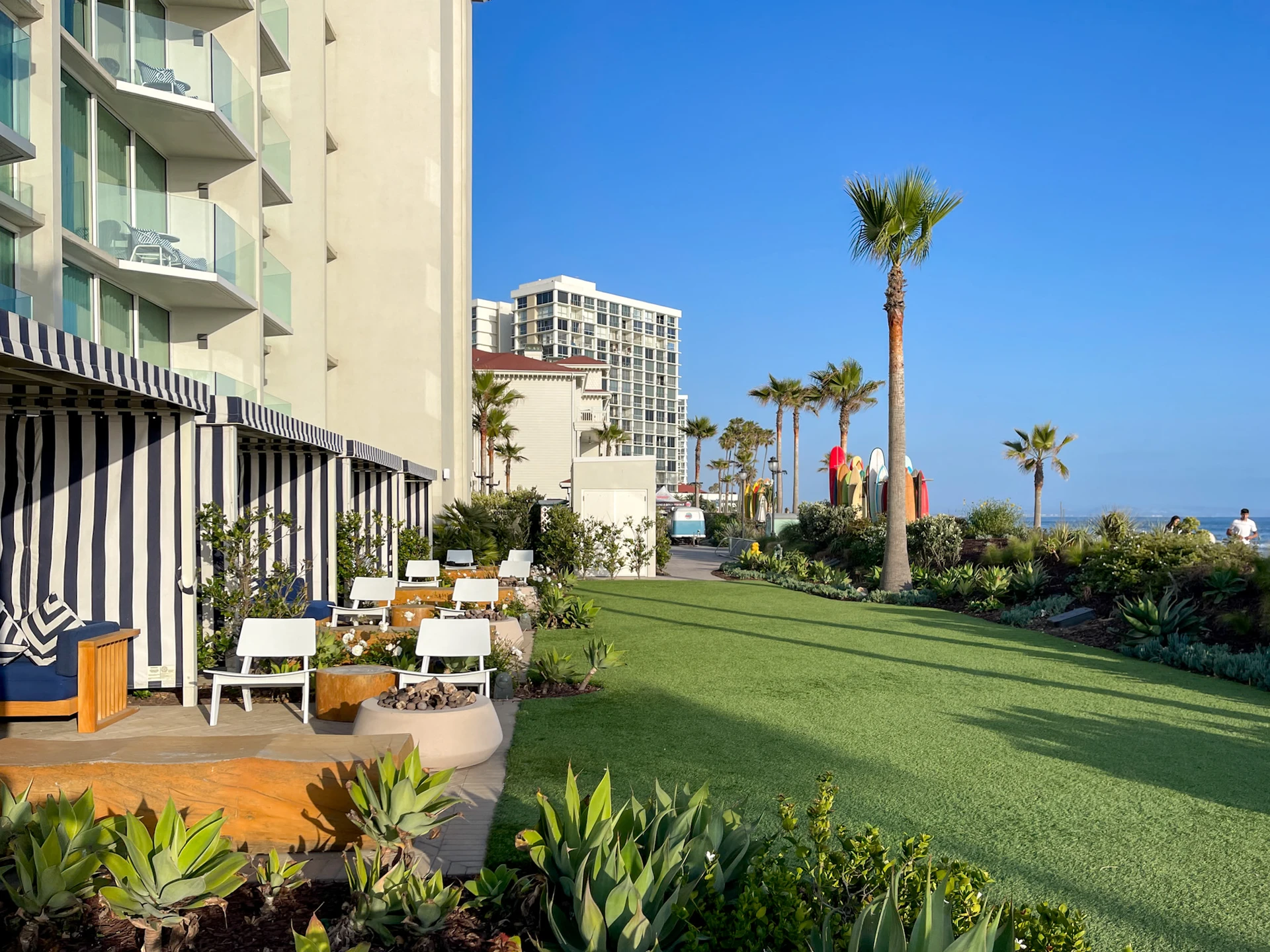 The grassy area in front of The Views Beachside Terrace with Fire Pit rooms.