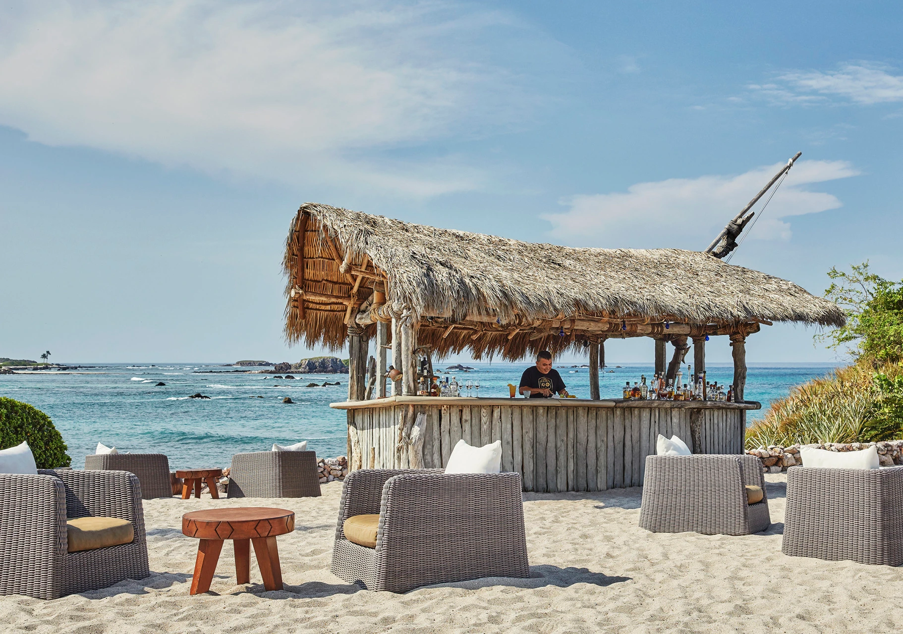 A bartender prepares drinks at The Beach Shack.