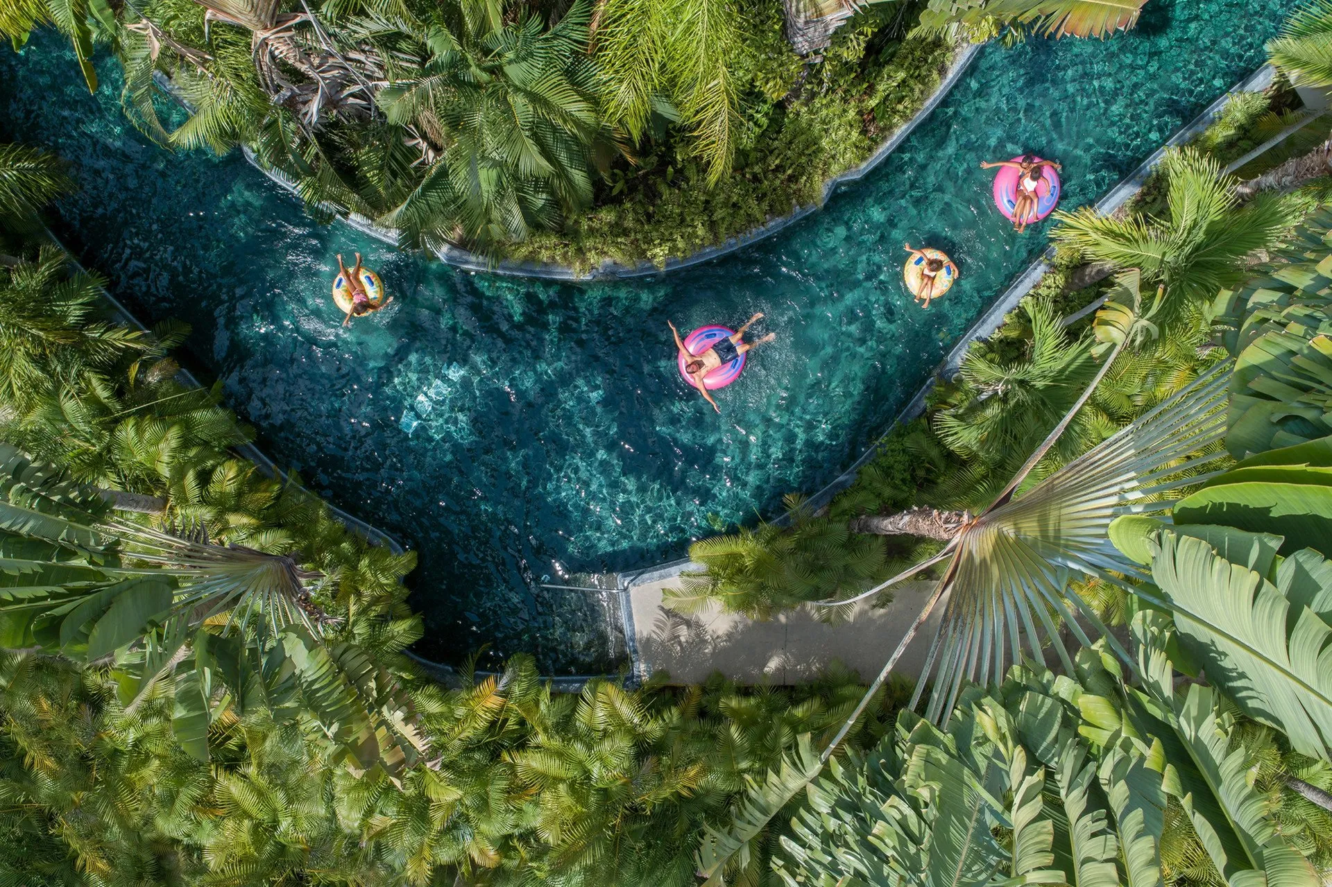 Kids float in innner tubes on the Four Seasons Punta Mita lazy river.