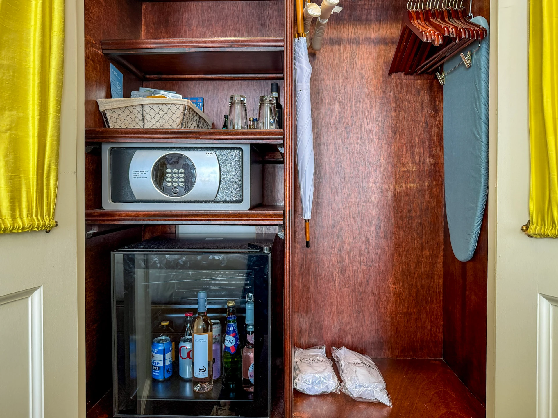 A view of the safe, minibar, hanging closet area in my Deluxe Queen.