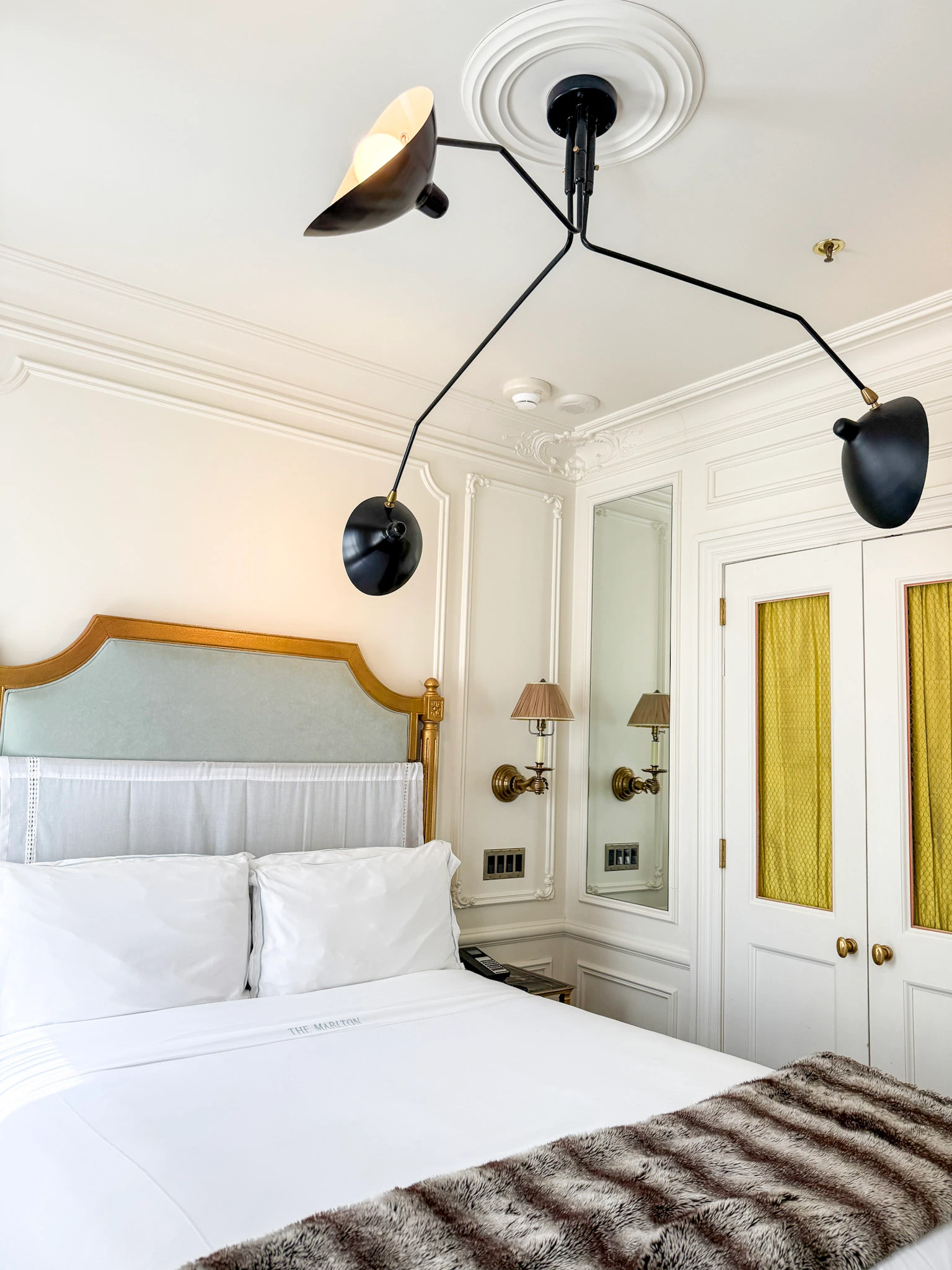 Mid-Century modern black light fixture in my Deluxe Queen room at The Marlton Hotel.