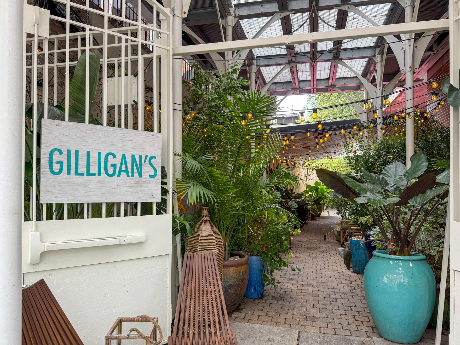 The entrance to Gilligan's with its huge garden of potted plants.