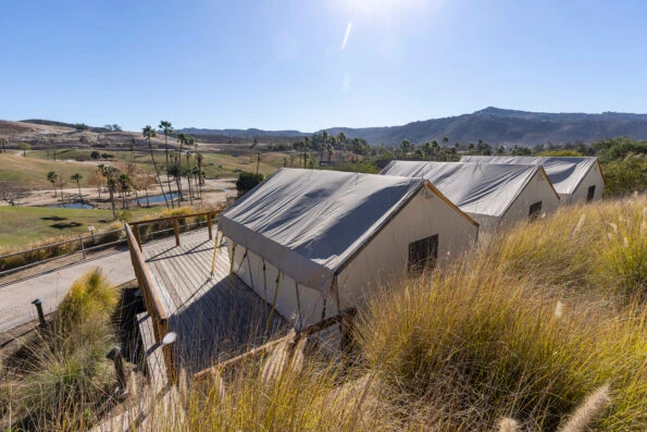 Roar and Snore Safari tents overlooking the savannah at San Diego Zoo Safari Park.