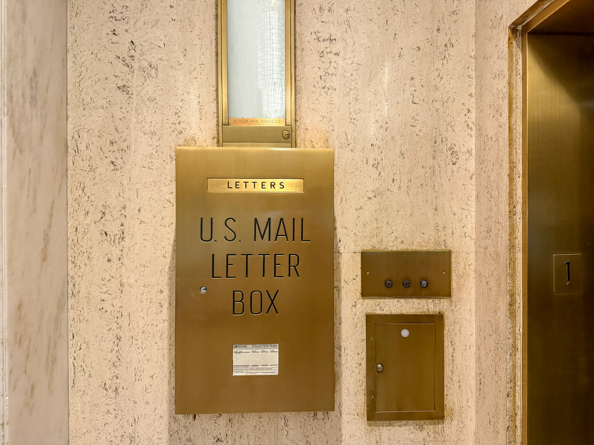 The historic mail shute in the lobby at St. Anthony Hotel.