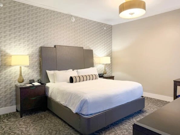 My bed at The St. Anthony with crisp white sheets.