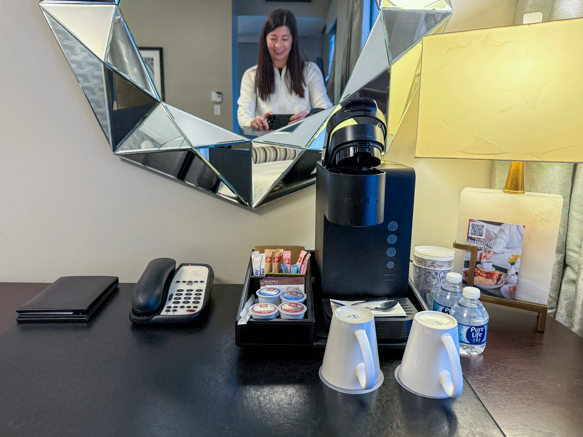 Keurig coffee maker on the desk area of my room at The St. Anthony San Antonio.