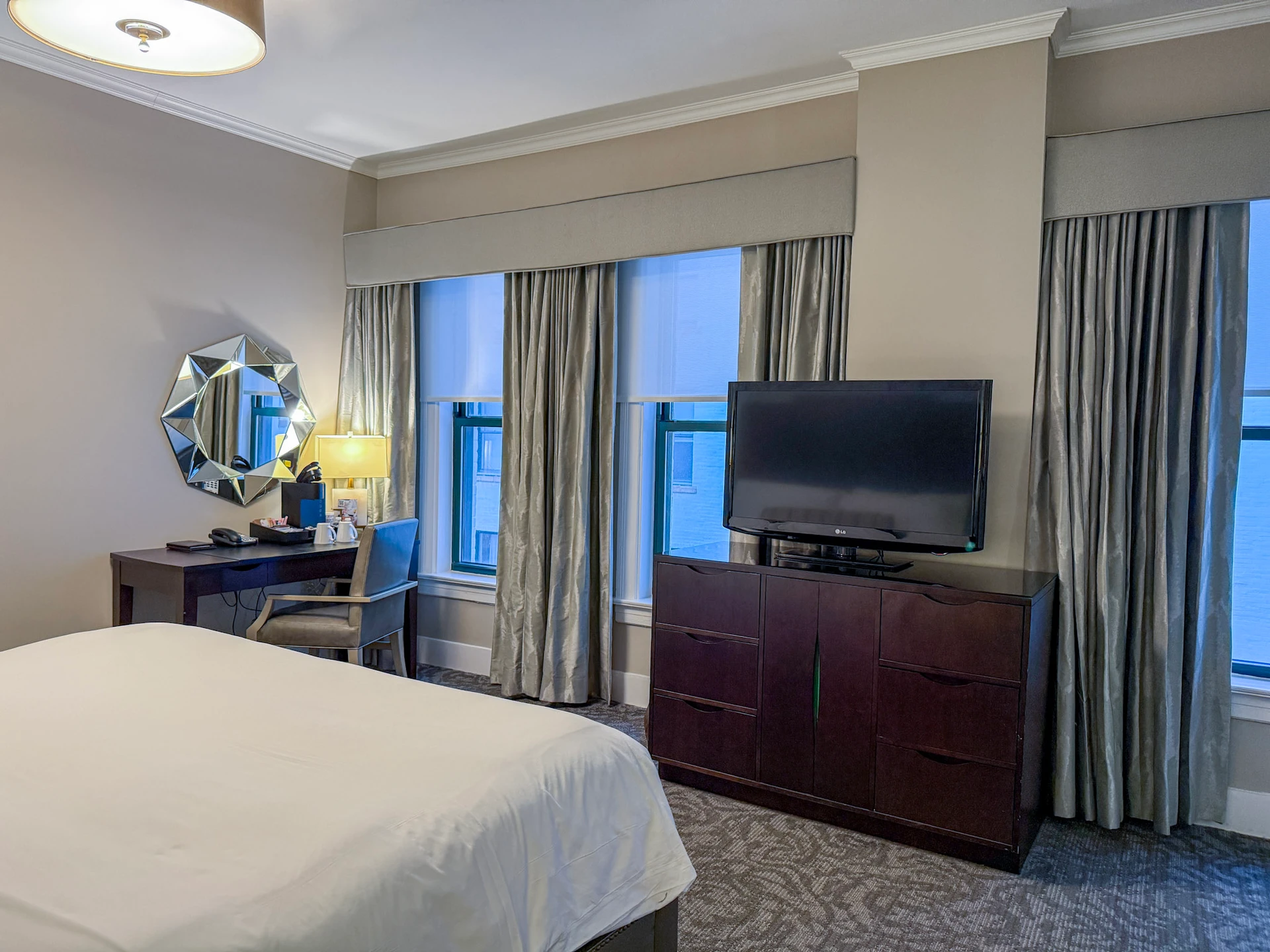 TV area and windows inside my room at The S. Anthony.