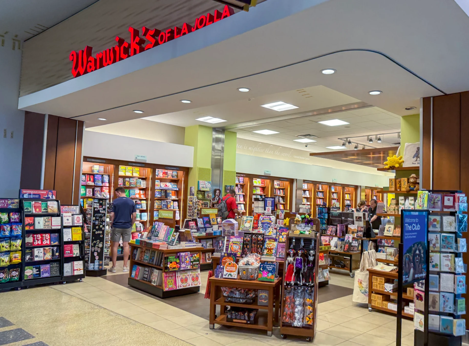People browse the books and toys at Warwick's of La Jolla at the airport,