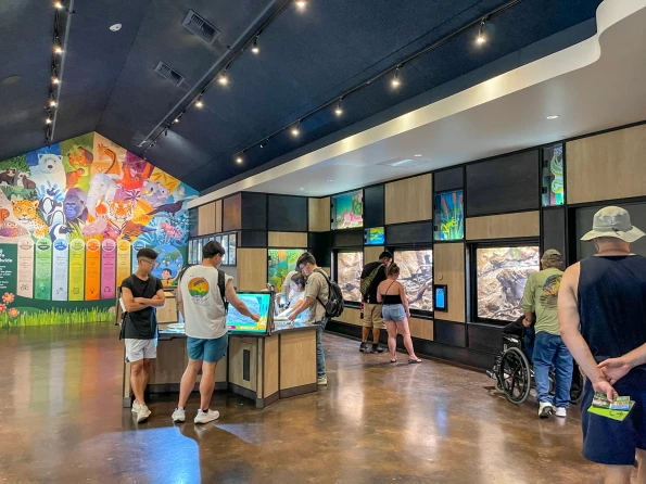 Guests browse the inside Cool Critters building in the children's zoo area.