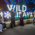 Musicians play in front of a Wild Holidays sign at San Diego Zoo Safari Park.